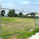 Planning due diligence checks - image of vacant block with wire fence around it.